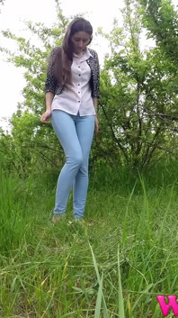 Skinny Brunette Just Had a Pee in the Tall Grass and Now She Puts on Her Jeans and Shoes