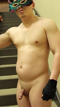 Flexing by the Stairs at the Gym