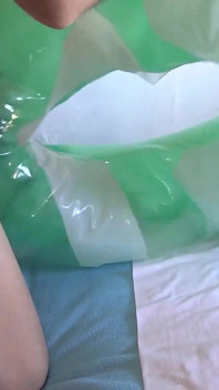 Playing with a Green and White Swimring