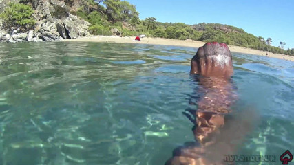 Nylondelux: Black Stocking and Anal Beads in the Sea