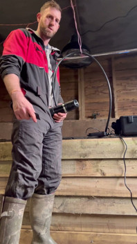 Farmer Smokes and Milks Himself with the Milking Machine