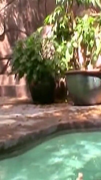 He Is Lying by the Pool When She Sits on His Cock