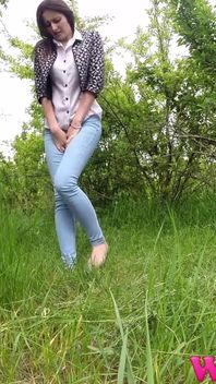 Desperate Skinny Girl in Jeans Trying to Hold Her Pee in the Forest