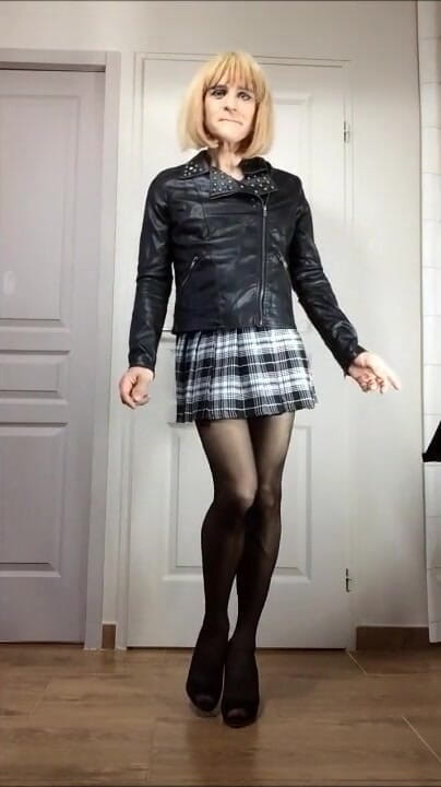 Faustine: Sexy crossdresser Faustine leather jacket and skirt.