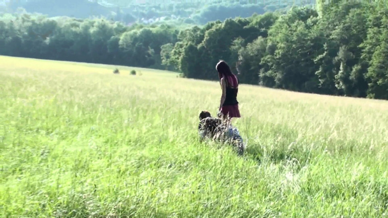 Femdom Austria: Pet on the leash in a meadow