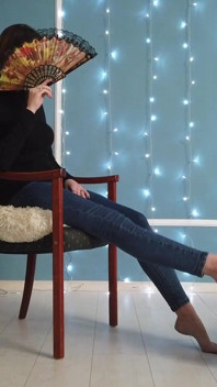 Worshiping the feet of a girl in blue jeans