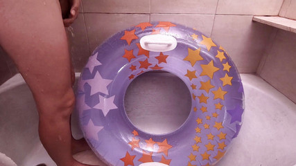 Inflatable Lovers: Bathroom with inflatable swim ring