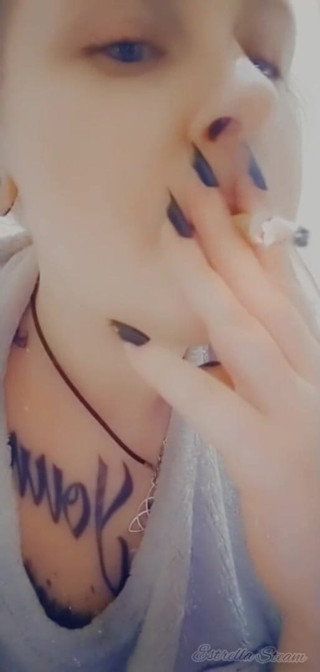 Estrella Steam: Girl with piercings smokes a cigarette
