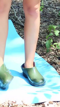 Nude Girl in the Forest Cutting Rubber Boots Into Shoes