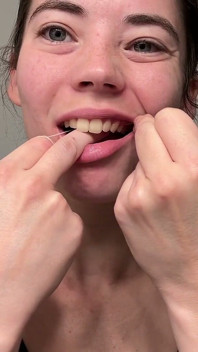 Flossing Teeth with Oral B Glide Dental Floss