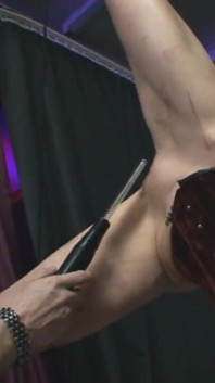 Dominating wax and dildo play