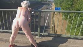 Horny Granny Masturbates on the Highway Bridge