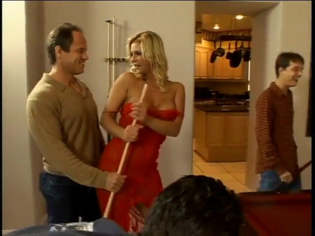 Group Bang: Red-lingeried blonde crouches atop cock while sucking and tugging two...