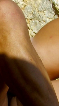 Anal blonde on the rocky beach