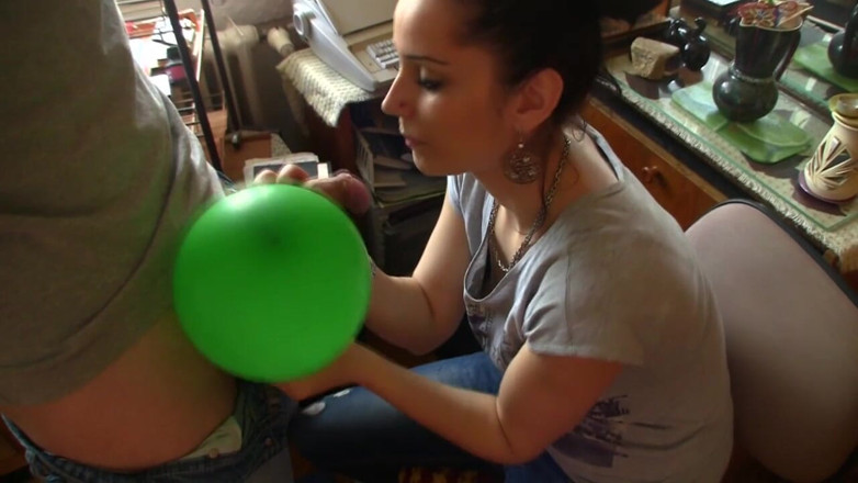 Facial flavor: Adorable brunette licking sperm from balloon