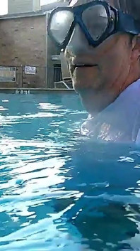 Couple Underwater Diving and Swimming