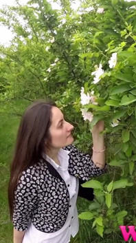 Desperate Girl Full Bladder Trying to Pee in the Forest and Smelling the Flowers