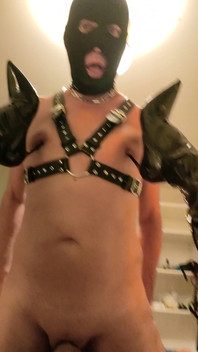 Mistress Digs the Heels of Her Boots Into Her Slave