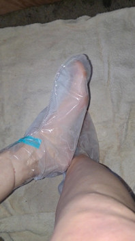 Pedicure Step Feet in Plastic Foot Mask Booties