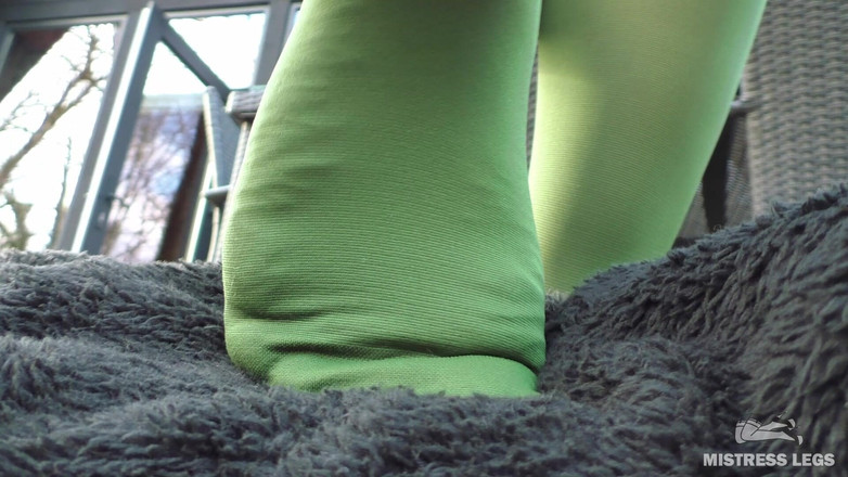 Mistress Legs: Goddess in Green Pantyhose Teases with Her Feet on the...