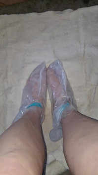 Pedicure Step Feet in Plastic Foot Mask Booties