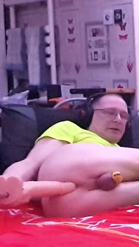Cock Locked in Chastity While Anal Fucking a Big White Dildo
