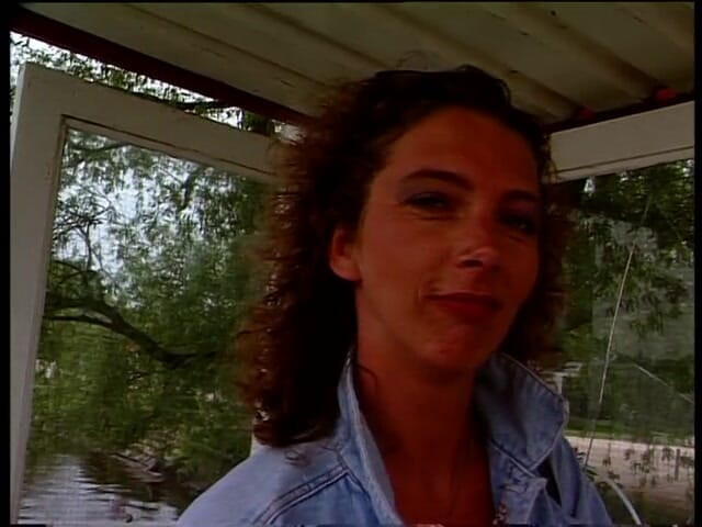 Lucky Cooch: Vintage brunette giving an interview outdoors