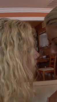 Two blonde babes play with each other