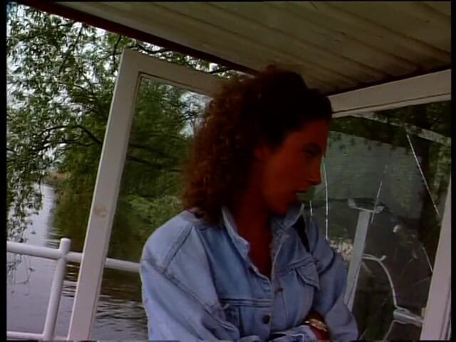 Lucky Cooch: Vintage brunette giving an interview outdoors