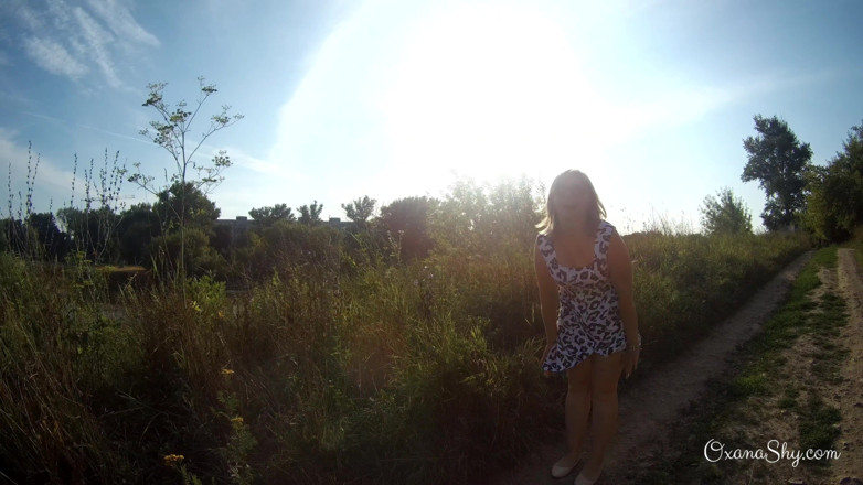 MILF Oxana: Flashing and naughty fun at the riverside