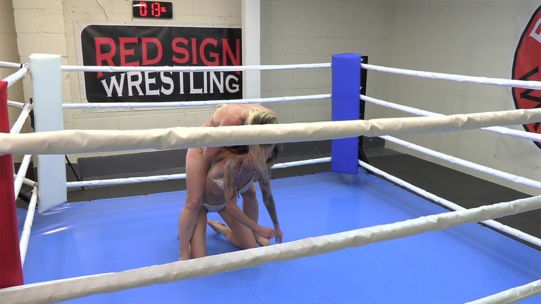 Red sign wrestling: Trouble V Charlotte Rose