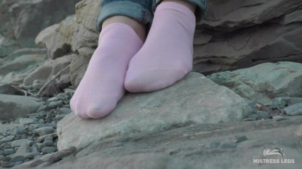 Mistress Legs: Sexy feet in pink ankle socks on the seashore