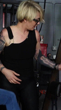 Slave Mila's Feet Dangle and Quiver as Mistress Baton Breaks in Heavy Wooden Paddle Over Her Jeans and Bare