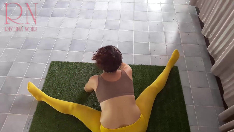 Regina Noir: Regina Noir. Yoga in yellow tights doing yoga in the...