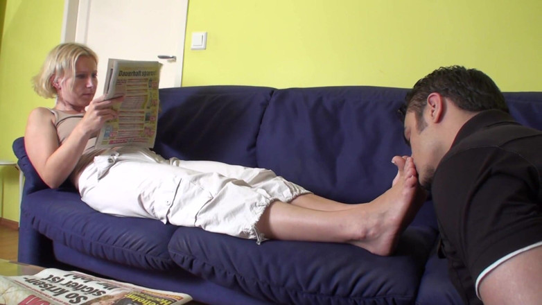 Foot Girls: Feet smelling while reading the newspaper