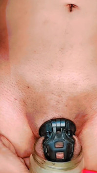 Standing Pissing in Chastity Cage