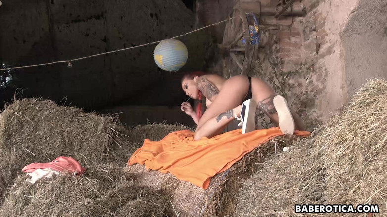 Baberotica: In the hay, redheaded Anne Wildx satisfies her cunt with...