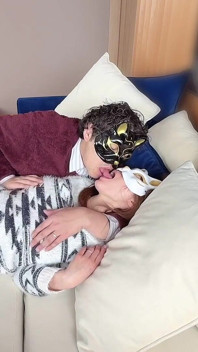 On the Sofa in Their Secret Room, They Shared Passionate Kisses Before Making Love, Expressing Their Deep Love.