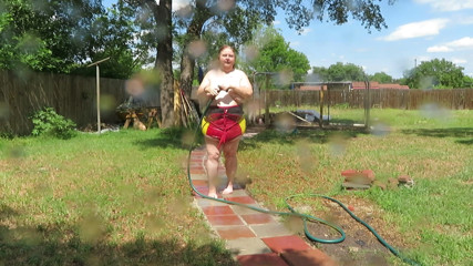 BBW nurse Vicki adventures with friends: Bikini fun with water then strip outside