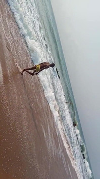 Having Fun on the Beach of Cotonou Alone for the First Time