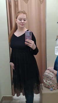 What Words Pop Into Your Head When You Look at the Red-haired Mistress in the Black Dress?