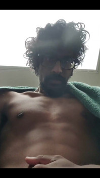 Masturbating