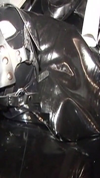Dominatrix Trains Hooded Slave with Huge Dildo