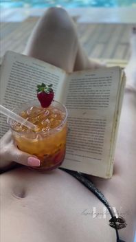 Reading by the Pool in a Bikini That Barely Counts as Spf