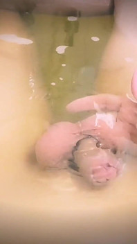 Young, Skinny and Slim Guy Bathing in Bathtub, His Dangling in the Water