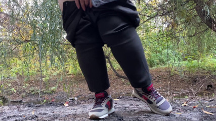 Elena: MILF dressed in pants pissing outdoors