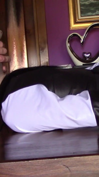 She's hogtied on a table, nylon hooded, roughly throated for ten minutes with massive cum swallow