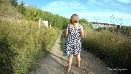 MILF Oxana: Flashing and naughty fun at the riverside
