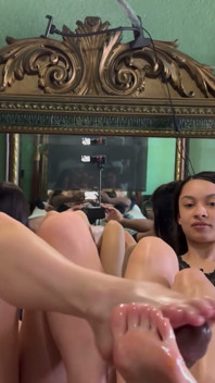 Iris Ivy Invites Her Sexy Friend to Give a Double Footjob Angle 3