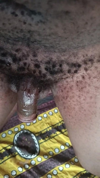 Hairy African Male Beating off Black Dick